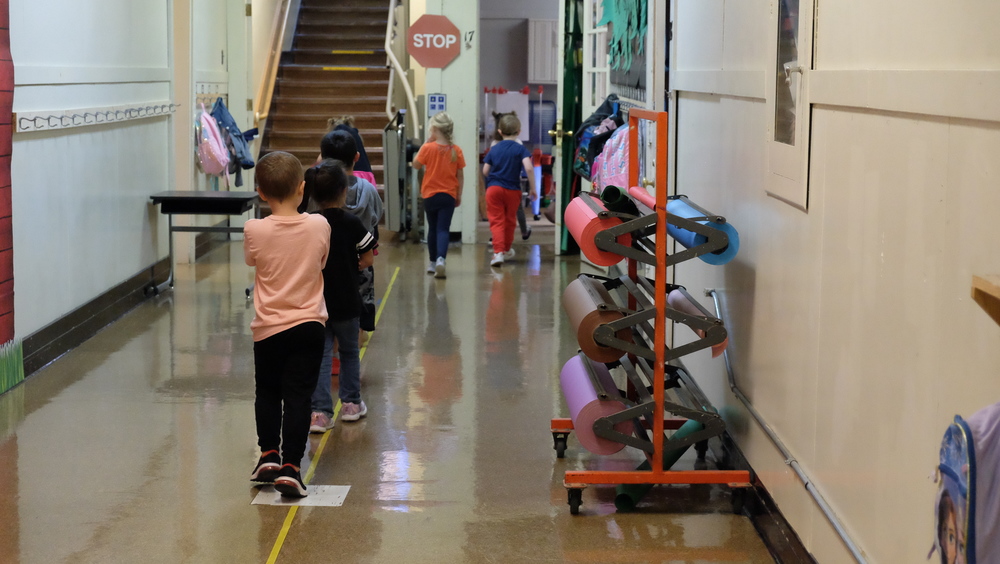 Morton Elementary students walk down hallway